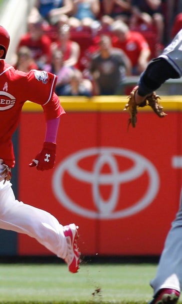 Reds clinch series with 4-1 win over Rockies